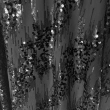 Load image into Gallery viewer, Classic sleeveless black sequined cocktail dress with V neck, split back, flared skirt, size 12. Dress and lining are 100% polyester. RW & CO.
In excellent condition, no tears/stains. Hand wash in cold, hang to dry.
Size 12
Measurements
Shoulders 16 inches
Bust 23 inches
Waist 16 1/2
Hip 22 inches
Length 44 inches