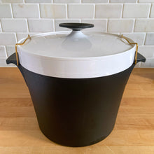 Load image into Gallery viewer, Vintage black and white THERM WARE ice bucket featuring brass brackets that hold the lid securely in place. Designed and crafted by David Douglas Company, USA, 1950s. This generous sized vessel is a fabulous example of mid-century design and ingenuity, perfect for any barware collection! In immaculate vintage condition. Measures 10 1/2 x 8 1/2 (incl. handles)