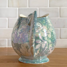 Load image into Gallery viewer, Beautiful vintage iridescent blue Brocade bone china milk or cream pitcher jug, rimmed in gold gilt. Crafted by Royal Winton Grimwades, England, between 1934 - 1950. A stunning example of Chintz and cottage and shabby chic style!
In great vintage condition, no chips/cracks/repairs, age-related crazing, minor wear to the gold rim, see photos.
Measures 6 1/4 x 4 x 4 3/4 inches