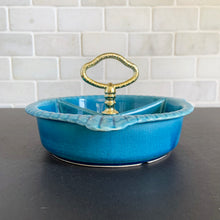 Load image into Gallery viewer, Vintage 3-part handled dish belonging to lazy susan set centrepiece, shape L65. Crafted by California Pottery, USA, circa 1950s. Works beautifully as a stand-alone serving piece for nuts, candies or your favourite snacks.
In excellent condition, no chips/cracks.
Measures 7 1/2 x 3 3/4 inches (incl. handles)
