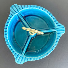 Load image into Gallery viewer, Vintage 3-part handled dish belonging to lazy susan set centrepiece, shape L65. Crafted by California Pottery, USA, circa 1950s. Works beautifully as a stand-alone serving piece for nuts, candies or your favourite snacks.
In excellent condition, no chips/cracks.
Measures 7 1/2 x 3 3/4 inches (incl. handles)