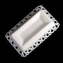 Load image into Gallery viewer, Gorgeous vintage white cat-on-nest milk glass dish featuring a lovely lace edge and blue glass eyes. Crafted by Westmoreland Glass, USA, circa 1950s/60s. A unique piece of pressed glass to use as a candy dish or catchall. A wonderful gift for the vintage glass enthusiast or cat lover!
In excellent condition, no chips, cracks or repairs. Lid and base have Westmoreland's maker's mark.
Measures 8 1/8 x 5 1/8 x 6 inches