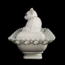 Load image into Gallery viewer, Gorgeous vintage white cat-on-nest milk glass dish featuring a lovely lace edge and blue glass eyes. Crafted by Westmoreland Glass, USA, circa 1950s/60s. A unique piece of pressed glass to use as a candy dish or catchall. A wonderful gift for the vintage glass enthusiast or cat lover!
In excellent condition, no chips, cracks or repairs. Lid and base have Westmoreland's maker's mark.
Measures 8 1/8 x 5 1/8 x 6 inches