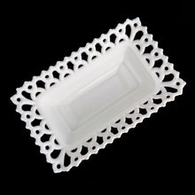 Load image into Gallery viewer, Gorgeous vintage white cat-on-nest milk glass dish featuring a lovely lace edge and blue glass eyes. Crafted by Westmoreland Glass, USA, circa 1950s/60s. A unique piece of pressed glass to use as a candy dish or catchall. A wonderful gift for the vintage glass enthusiast or cat lover!
In excellent condition, no chips, cracks or repairs. Lid and base have Westmoreland's maker's mark.
Measures 8 1/8 x 5 1/8 x 6 inches