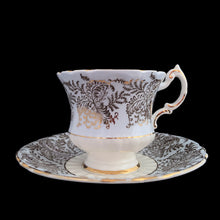 Load image into Gallery viewer, Vintage fine bone china blue teacup and saucer with colourful roses and gold gilt filigree and trim. Crafted by PARAGON, England. A lovely way to enjoy a cuppa tea!
In excellent condition, no chips, cracks or repairs. Single warrant stamp.
Measures 3 1/4 x 2 7/8 inches | Saucer measures 5 5/8 inches