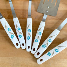 Load image into Gallery viewer, Close-up of six white melamine handles from vintage Japanese kitchen utensil set, teal blue floral and wheat stem pattern