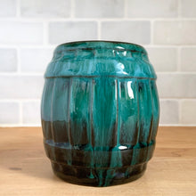 Load image into Gallery viewer, Front side view detail of the barrel mug in green drip glaze
