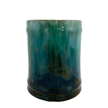 Load image into Gallery viewer, Front-on view of Blue Mountain Pottery green drip glaze mug without handle, showing cylindrical form and teal-to-dark drip glaze pattern