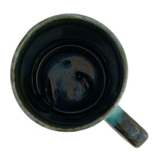 Load image into Gallery viewer, Overhead interior view of Blue Mountain Pottery green drip glaze mug showing dark glazed interior and rim
