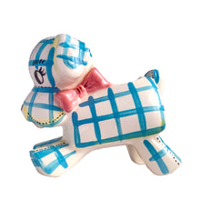 Load image into Gallery viewer, Adorable kitschy white puppy dog planter with blue stripes, black stitching and a pink bow. Crafted by Napco, Japan, 1950s. A sweet addition for your new addition. Use for tiny plants or repurpose to hold baby accessories.
In excellent as found vintage condition, no chips/cracks/repairs, normal crazing present.
Measures 5 3/4 x 3 x 5 1/4 inches