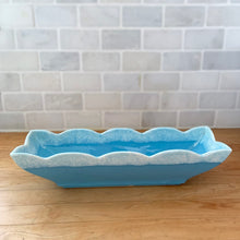 Load image into Gallery viewer, Vintage blue and white drip glazed planter with scalloped edge, shape 74. Crafted by Hull Pottery, USA, 1960s. Perfect for your favourite houseplant, succulent or use as a catchall. A nice piece for your art pottery collection and also makes a great gift!
In excellent condition, no chips/cracks/repairs. Maker's mark on the bottom.
Measures 13 x 4 1/4 x 3 inches