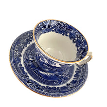 Load image into Gallery viewer, A timeless classic, this 1930s Burleighware "Willow" teacup and saucer will take you on a journey through history! Featuring a traditional Chinoiserie pattern in cobalt blue on white porcelain with gold gilt rims, this beautiful vintage piece crafted by Burleigh Pottery, England will be a cherished addition to your collection.
