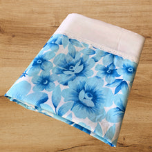 Load image into Gallery viewer, Vintage Serenity double/full poly cotton flat, fitted bed sheets, with two pillowcases. These linens feature a large scale blue floral print on white ground, finished with a white band and eyelet detail. Crafted by Wabasso, Canada, 1976 – 1979. Create a restful slumber with these beautifully designed and well-made linens, or repurpose for crafting, quilting or dressmaking!