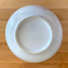 Load image into Gallery viewer, Underside of vintage-style blue and white ceramic farmhouse mixing bowl showing the unglazed base and ceramic construction