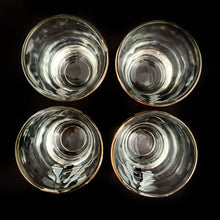 Load image into Gallery viewer, Set of four vintage shot glasses illustrated with a black bowling ball and pins graphic with gold rim. Crafted by Dominion Glass, Canada, 1970s. If you have a bowler and shooter lover in your life, these are the perfect glasses!
In excellent used condition, no chips.
Measures 2 x 2 1/2 inches
Capacity 1 ounce