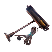 Load image into Gallery viewer, Antique wall hung metal picture light with adjustable blackened brass metal shade in a deep copper-brown. This heavy-weighted lamp affixes to the wall, adjustable either upward or downward at the wall plate and the light head is extends.
In as found vintage condition, in working order. We recommend all antique/vintage lighting be upgraded to current ESA standards by a license professional.
Measures 9 1/2 x 11 inches, extends to 17 1/2 inches