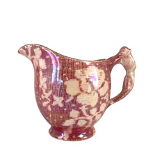 Load image into Gallery viewer, Beautiful vintage mid-century "Brocade Cranberry" iridescent bone china creamer featuring a rosebud handle, rimmed in gold gilt. Crafted by Royal Winton Grimwades, England, between 1934 - 1950. A stunning example of Chintz and cottage style! In excellent vintage condition, free from chips/cracks/repairs, normal crazing. Creamer measures 2 1/2 x 3 1/2 inches