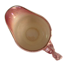 Load image into Gallery viewer, Beautiful vintage mid-century "Brocade Cranberry" iridescent bone china creamer featuring a rosebud handle, rimmed in gold gilt. Crafted by Royal Winton Grimwades, England, between 1934 - 1950. A stunning example of Chintz and cottage style! In excellent vintage condition, free from chips/cracks/repairs, normal crazing. Creamer measures 2 1/2 x 3 1/2 inches