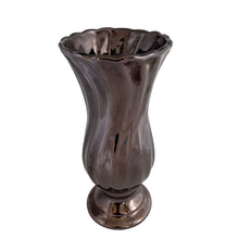 Load image into Gallery viewer, Vintage smooth swirled footed flower vase with scalloped rim, featuring a high lustre metallic deep bronze glaze that creates fluid movement and visual depth across its swirled surface. Crafted by Haeger Pottery, USA, 1990s. This vase offers a graceful silhouette perfect for Mid-Century Modern, transitional, or eclectic interiors. Its warm, earthy tones and sculptural texture make it a standout accent for mantels, shelves, or side tables. Ideal for collectors of American art pottery
