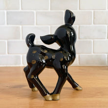Load image into Gallery viewer, Vintage mid century kitsch brown deer fawn redware ceramic figurine, its head sweetly tilted, large pink ears and gold spots. Crafted by TILSO, Japan, 1950s. An adorable addition to your Christmas decor or deer collection! In excellent condition, no chips. Marked "JAPAN". Measures 3 1/2 x 1 7/8 x 4 3/4 inches