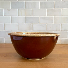 Load image into Gallery viewer, Vintage brown drip glaze oven-proof mixing bowls with rolled edge. Crafted by Hull Pottery, USA, 1960s. What a fabulous way to prepare or serve your favourite dish!
In excellent condition, no chips/cracks/repairs. Maker's marks.
7 Inch Bowl Measures: 7 1/4 x 3 1/2 inches, in excellent vintage condition, no chips/cracks/repairs, minor wear. Maker's marks.