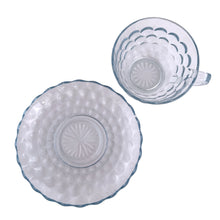 Load image into Gallery viewer, Vintage depression era "Bubble Blue" pressed glass cup and saucer set. Crafted by Anchor Hocking, USA, between 1942 - 1948. Sip a nice hot cup of tea or coffee from this classic glassware! In excellent condition, free from chips. Cup measures 3 3/4 x 2 1/4 inches Saucer measures 5 5/8 inches