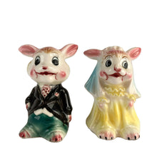 Load image into Gallery viewer, Vintage hand painted anthropomorphic rabbit bride and groom salt and pepper shakers. PY, Japan, 1950s. Add these adorable kitschy shakers to your collection or give as a wedding gift!
In as found vintage condition, bridge bunny has a chip to the tip of the ear, no cracks/repairs. Marked, Japan.
Measures 2 1/4 x 1 3/4 x 3 1/8 inches