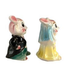 Load image into Gallery viewer, Vintage hand painted anthropomorphic rabbit bride and groom salt and pepper shakers. PY, Japan, 1950s. Add these adorable kitschy shakers to your collection or give as a wedding gift!
In as found vintage condition, bridge bunny has a chip to the tip of the ear, no cracks/repairs. Marked, Japan.
Measures 2 1/4 x 1 3/4 x 3 1/8 inches