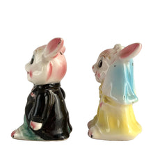 Load image into Gallery viewer, Vintage hand painted anthropomorphic rabbit bride and groom salt and pepper shakers. PY, Japan, 1950s. Add these adorable kitschy shakers to your collection or give as a wedding gift!
In as found vintage condition, bridge bunny has a chip to the tip of the ear, no cracks/repairs. Marked, Japan.
Measures 2 1/4 x 1 3/4 x 3 1/8 inches
