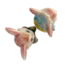 Load image into Gallery viewer, Vintage hand painted anthropomorphic rabbit bride and groom salt and pepper shakers. PY, Japan, 1950s. Add these adorable kitschy shakers to your collection or give as a wedding gift!
In as found vintage condition, bridge bunny has a chip to the tip of the ear, no cracks/repairs. Marked, Japan.
Measures 2 1/4 x 1 3/4 x 3 1/8 inches