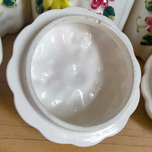 Load image into Gallery viewer, Rare set of three vintage mid-century white figural pumpkin squash ceramic canisters. These three dimensional beauties are hand painted with colourful butterflies and flowers. Each lid is topped with a floral finial. Enterprise Sales & Distributors import, Japan, 1960s. Perfect for the kitchen kitsch collectible enthusiast!