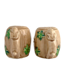 Load image into Gallery viewer, Vintage souvenir ceramic salt and pepper shakers featuring an embossed Canadian Mounted Police on horseback, green maple leaves and darling baby rabbit handles finished in tan coloured glaze. Crafted in Japan, 1950s. A sweet set of collectible shakers to use or display! In excellent condition, no chips/cracks/repairs. No corks. Measures 2 3/4 x 2 1/8 inches