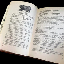 Load image into Gallery viewer, Vintage The Canadiana Cookbook, hardcover cookbook "a complete heritage of Canadian cooking" with recipes organized by province. Written by Mme. Jehane Benoit, renowned Canadian culinary author, speaker, commentator, journalist and broadcaster during the 50s/60s/70s. Its 203 pages of regional recipes and line illustrations. Published by Pagurian Press, Canada, 1970, first edition. The bound book is in excellent condition showing normal age-related page yellowing and the jacket cover has wear and is torn.