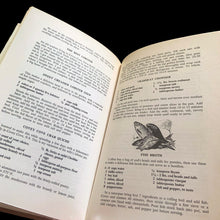 Load image into Gallery viewer, Vintage The Canadiana Cookbook, hardcover cookbook "a complete heritage of Canadian cooking" with recipes organized by province. Written by Mme. Jehane Benoit, renowned Canadian culinary author, speaker, commentator, journalist and broadcaster during the 50s/60s/70s. Its 203 pages of regional recipes and line illustrations. Published by Pagurian Press, Canada, 1970, first edition. The bound book is in excellent condition showing normal age-related page yellowing and the jacket cover has wear and is torn.