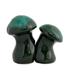 Load image into Gallery viewer, Canuck Pottery Evangeline green drip glaze salt and pepper shakers nestled together, showing the pepper shaker tucked into the groove of the salt shaker