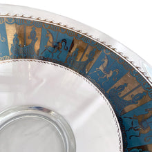Load image into Gallery viewer, Fabulous vintage mid-century modern Carousel punch bowl with ten matching roly poly glasses and gold toned metal ladle. The glassware is decorated with carousel horses and carriages in 22kt gold on teal blue paint. Crafted by Colony, USA, circa 1960s. Perfect for serving eggnog, alcohol or non-alcohol punch at your next soirée! Stunning doesn't quite describe this fabulous set which is sure to be a standout at your next party!