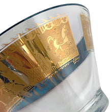 Load image into Gallery viewer, Fabulous vintage mid-century modern Carousel punch bowl with ten matching roly poly glasses and gold toned metal ladle. The glassware is decorated with carousel horses and carriages in 22kt gold on teal blue paint. Crafted by Colony, USA, circa 1960s. Perfect for serving eggnog, alcohol or non-alcohol punch at your next soirée! Stunning doesn't quite describe this fabulous set which is sure to be a standout at your next party!