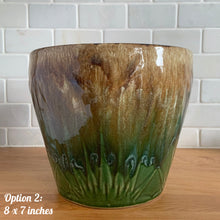 Load image into Gallery viewer, The earth and sky are represented beautifully in this large vintage mid-century Celestial Moon and Star ceramic garden planter pot featuring embossed starburst suns and moons in brown and green drip glaze. Designed and crafted by Robinson Ransbottom Pottery Company, in Roseville Ohio, USA, circa 1960s. This highly collectible planter will look gorgeous filled with your favourite greenery or flowers. Perfect for the container garden enthusiast!
Option 2: 8 x 7 inches. Great vintage condition