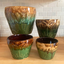Load image into Gallery viewer, Vintage mid-century Celestial Moon and Star ceramic stoneware garden planter with embossed starburst suns and moons in brown ochre green drip glaze. Robinson Ransbottom Pottery Co., USA, 1960s. This highly collectible garden planter will look gorgeous filled with your favourite greenery or flowers.
In excellent vintage condition, minor age-related wear and crazing, no chips/cracks. See photos for maker's marks. Sizes: 5, 6, 7 and 9 inches