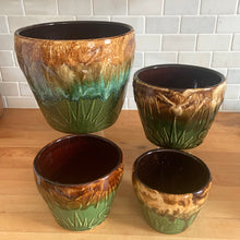 Load image into Gallery viewer, Vintage mid-century Celestial Moon and Star ceramic stoneware garden planter with embossed starburst suns and moons in brown ochre green drip glaze. Robinson Ransbottom Pottery Co., USA, 1960s. This highly collectible garden planter will look gorgeous filled with your favourite greenery or flowers.
In excellent vintage condition, minor age-related wear and crazing, no chips/cracks. See photos for maker's marks. Sizes: 5, 6, 7 and 9 inches