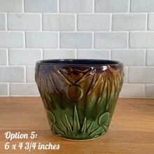 Load image into Gallery viewer, The earth and sky are represented beautifully in this large vintage mid-century Celestial Moon and Star ceramic garden planter pot featuring embossed starburst suns and moons in brown and green drip glaze. Designed and crafted by Robinson Ransbottom Pottery Company, in Roseville Ohio, USA, circa 1960s. This highly collectible planter will look gorgeous filled with your favourite green. Option 5: 6 x 4 3/4 inches
Excellent vintage condition, no chips/cracks/repairs, normal age-related crazing. Maker's mark