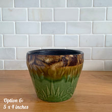 Load image into Gallery viewer, Large vintage mid-century Celestial Moon and Star ceramic garden planter pot featuring embossed starburst suns and moons in brown and green drip glaze. Crafted by Robinson Ransbottom Pottery Company, in Roseville Ohio, USA, circa 1960s. This highly collectible planter will look gorgeous filled with your favourite greenery or flowers. Perfect for the container garden enthusiast! Option 6: 5 x 4 inches
In as found vintage condition, chip to the rim, no cracks/repairs, normal age-related crazing. Maker's mark.