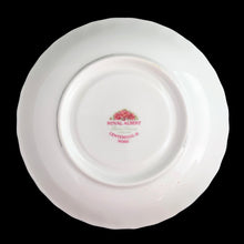 Load image into Gallery viewer, A lovely vintage Centennial Rose Monstrose shaped bone china teacup and saucer. Each piece has a lovely scalloped edge featuring a hand painted rose sprays with gold gilt trim. Crafted by Royal Albert, England, circa 1960s/70s. The perfect vessel for an excellent cuppa tea!
In excellent condition, no chips, cracks or repairs. Maker's marks on the bottom.
Teacup measures 3 1/2 x 2 3/4 inches | Saucer measures 5 1/2 inches