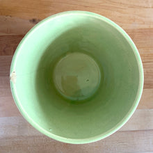 Load image into Gallery viewer, Rare vintage chartreuse green planter pot with embossed flower motif and zig zag borders. Crafted by McCoy Pottery, 1954. This rare planter is must for any McCoy art pottery collector. A wonderful piece to elevate your home and garden decor or to give as a gift!
In as found vintage condition, chip to the rim and crack, no repairs. Normal age-related crazing and manufacturer's glaze pops. Maker's mark on the bottom.
Measures 6 1/2 x 6 1/8 inches