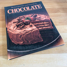 Load image into Gallery viewer, Better Homes and Gardens is known for its fabulous cookbooks. This hardcover cookbook focuses on Chocolate recipes. Its 96 pages are filled with amazing recipes along with many colour photographs. Originally published by Meredith Corporation, USA, 1984. This is the fifth printing, 1985. In great vintage condition with normal age-related yellowing.