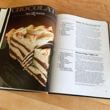 Load image into Gallery viewer, Better Homes and Gardens is known for its fabulous cookbooks. This hardcover cookbook focuses on Chocolate recipes. Its 96 pages are filled with amazing recipes along with many colour photographs. Originally published by Meredith Corporation, USA, 1984. This is the fifth printing, 1985. In great vintage condition with normal age-related yellowing.