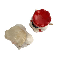 Load image into Gallery viewer, Vintage mid-century beautifully hand painted ceramic Christmas angel figurines. One, a choir boy with music song sheet and red hat and one a blonde haired girl holding a black lyre harp. Both angels wear robes of white with red trim and gold tipped wings. Made in, Japan, 1950s. These highly collectible figurines are the perfect accent for your Christmas holiday display!
Both angels are in excellent vintage condition with minor paint loss, no chips/cracks/repairs.