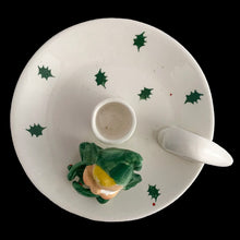 Load image into Gallery viewer, Vintage mid-century white ceramic candle holder with seated green pixie elf, holly leaves and finger ring. Crafted by Holt Howard, Japan, 1959. This highly collectible kitschy candle holder is the perfect accent for your Christmas holiday display!
In as found condition, roughness on rim of the plate and paint loss on pixie's face.
Measures 5 1/2 x 2 1/2