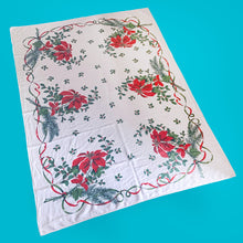 Load image into Gallery viewer, Festive vintage natural cotton Christmas rectangular tablecloth featuring Poinsettia flowers, pine boughs and holly berries bordered with green and red ribbons. A lovely table covering to add festive flair to your holiday celebration!
In excellent condition, free from stains/tears.
Measures 76 x 57 inches