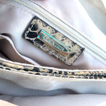 Load image into Gallery viewer, Pre-owned Ciana taupe faux python cross-body bag with adjustable strap is crafted from durable textured cow leather and features polished silver tone hardware. By Danier Leather. The zippered polyester lined interior has three compartments, one zippered pocket and metal keychain holder, one with snap closure, and one with 2-part open pocket. Exterior 2 zippered and snap closure pockets. A stylish, durable and practical accessory.